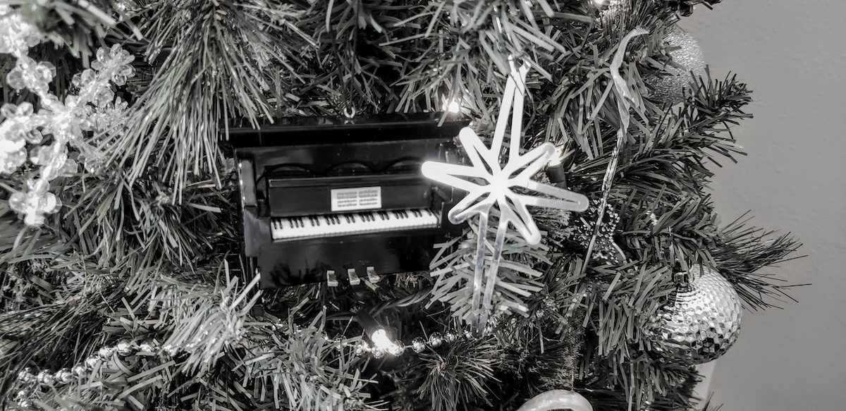 light the world ornament on christmas tree